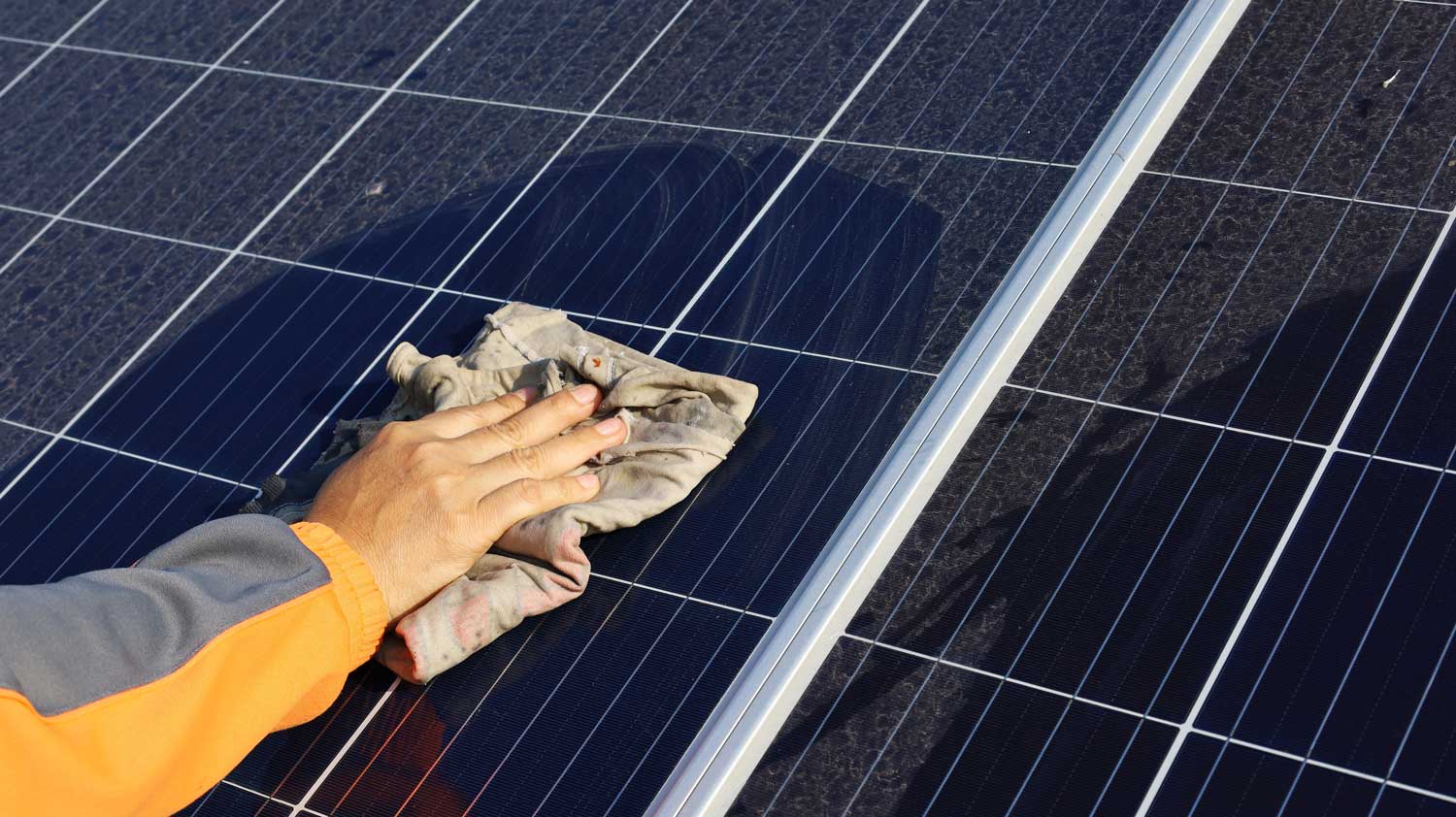 An image of change on a solar panel - save on bills with solar power and Solar Energy Partners.